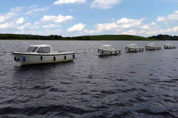 a boat sitting next to a body of water